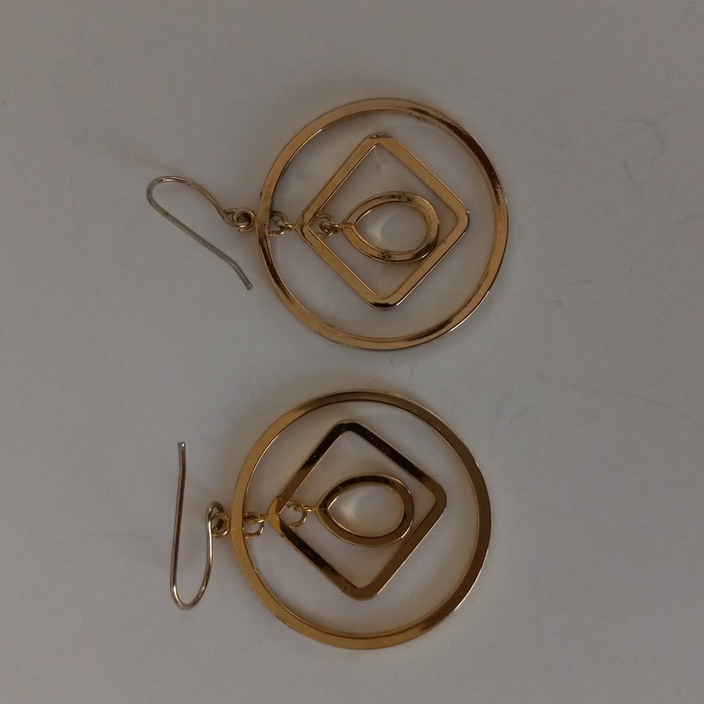 Gold tone earrings.